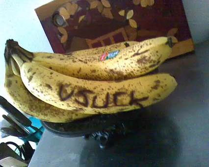 A bunch of bananas with writing on them

Description automatically generated